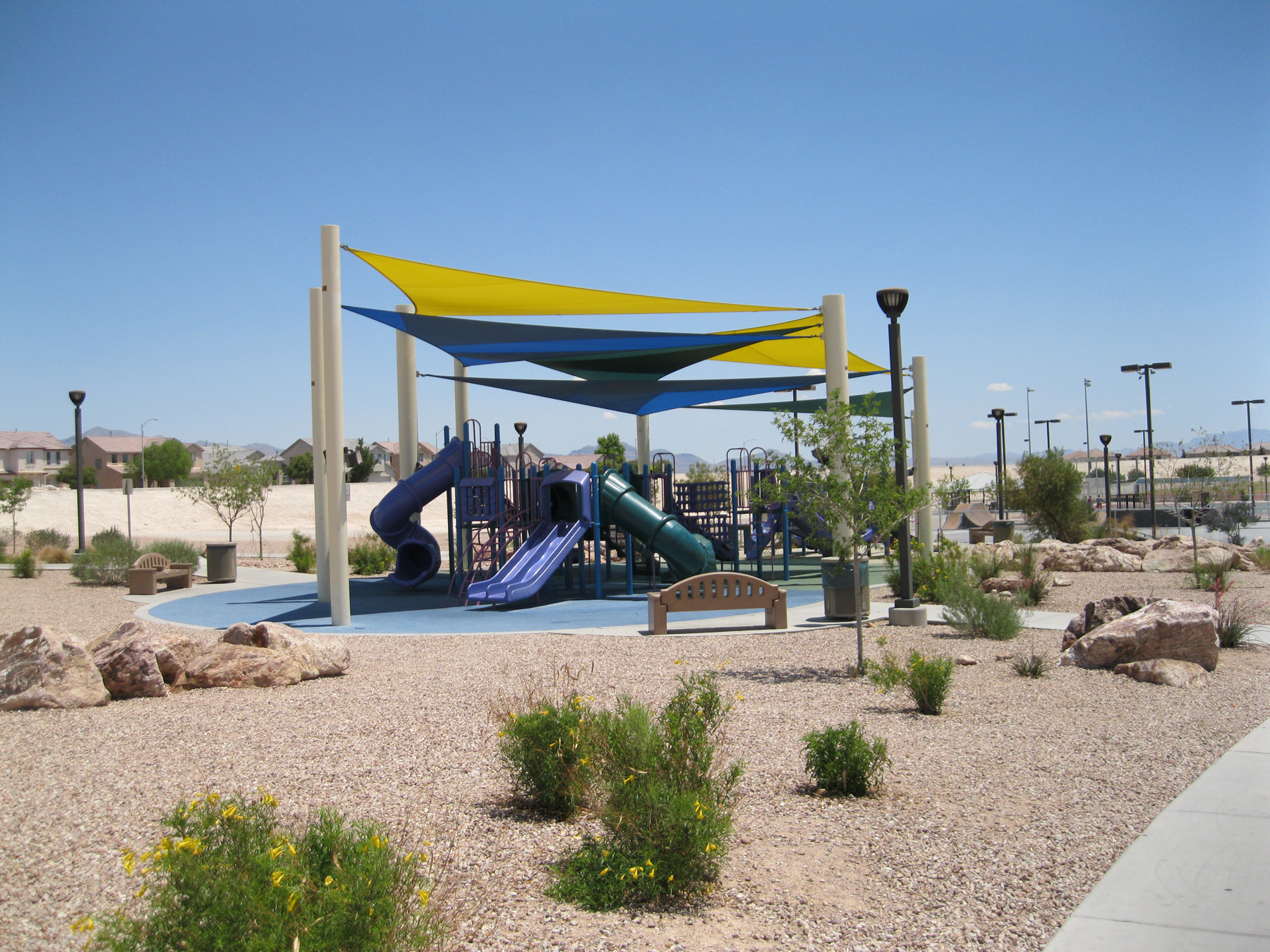 outdoor playground equipment under usa shades