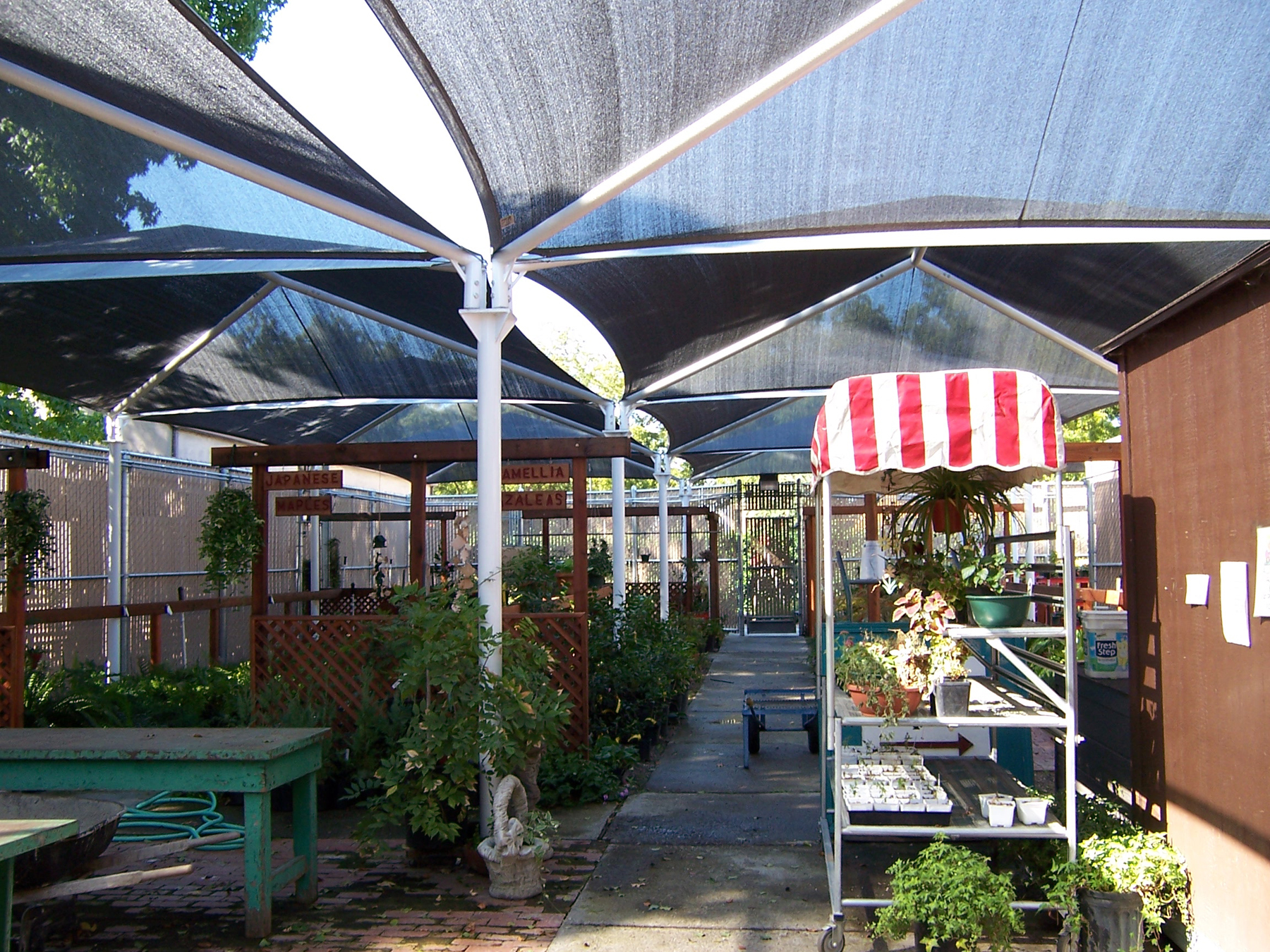 usa shade structures covering green house plants