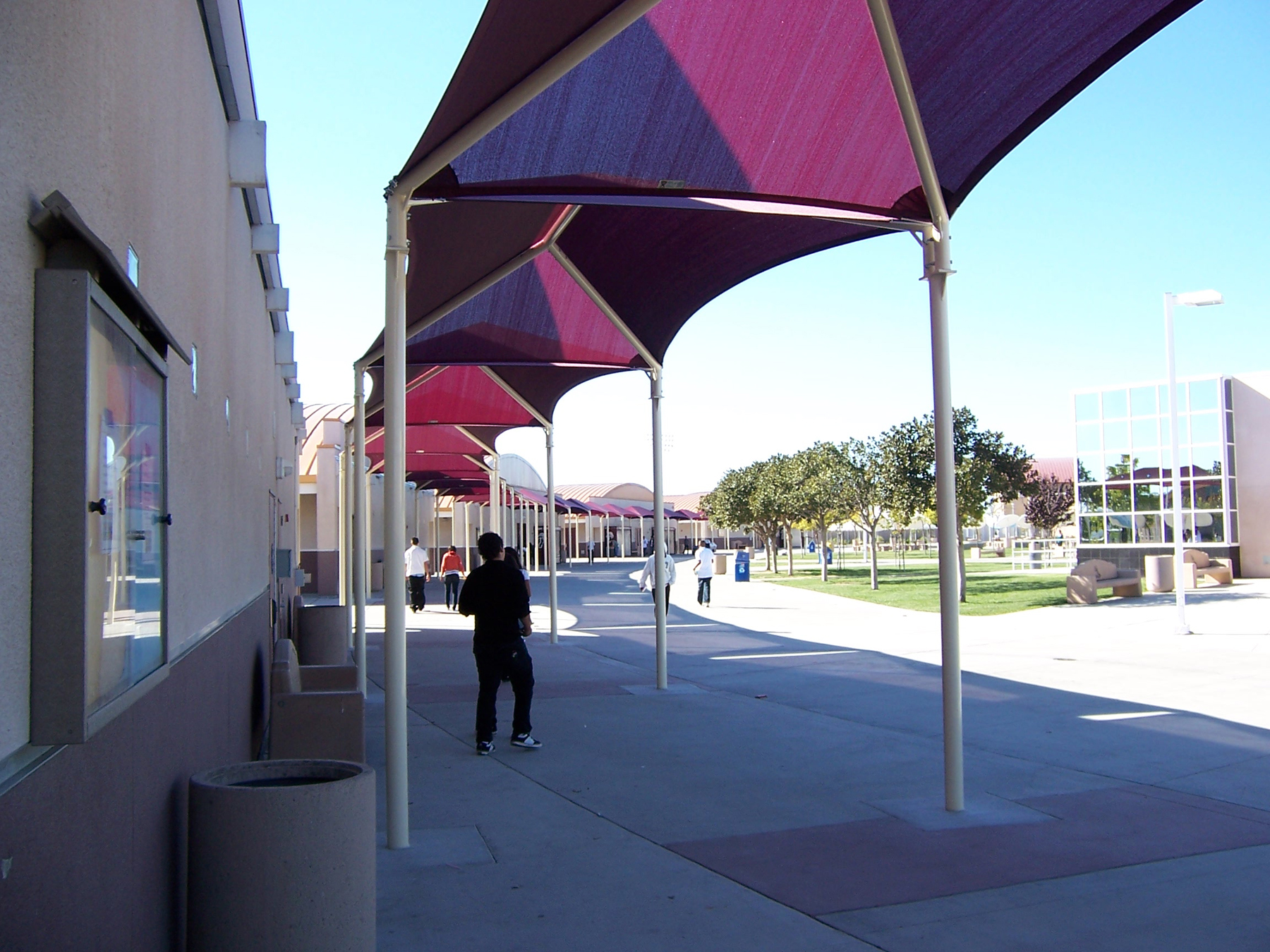 students outside of school walking under usa shades