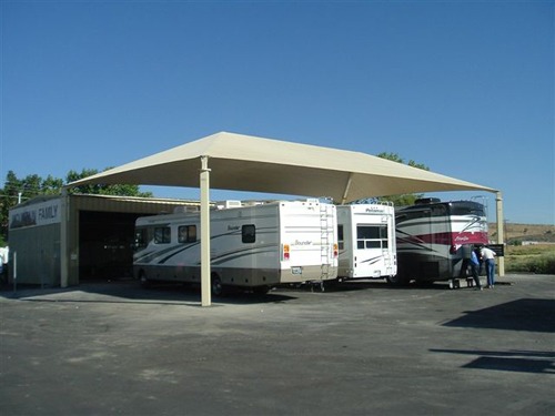 multiple motorhomes covered by usa shade