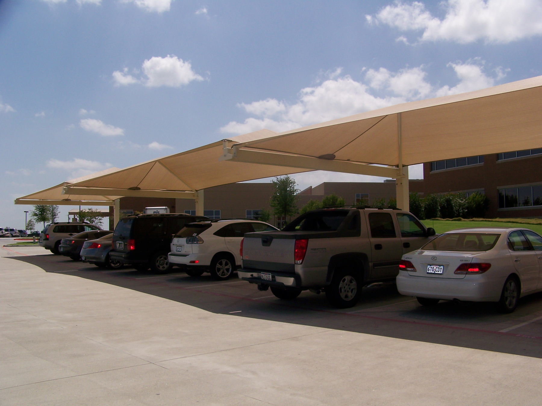 cars parked in outdoor spots under usa shades