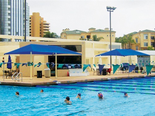 people swimming in outdoor pool