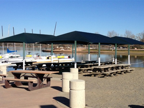 lakeside picnic tables under usa shades