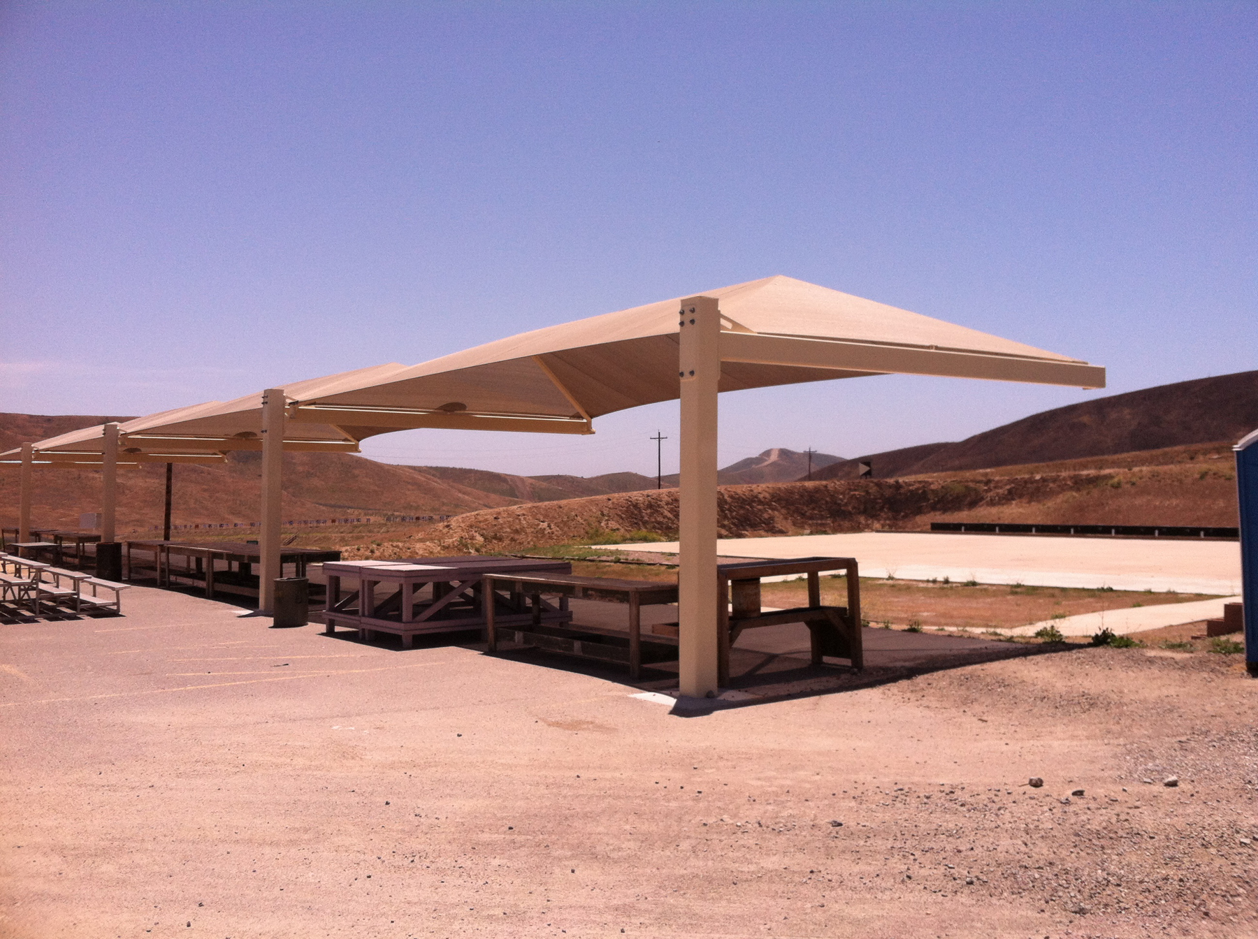 tan sun shades covering shoot range stations