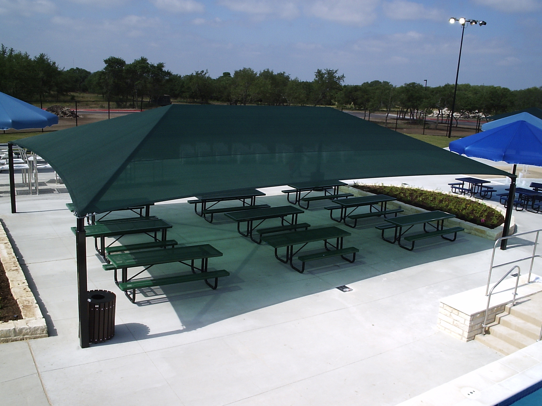 large usa shade covering multiple picnic tables
