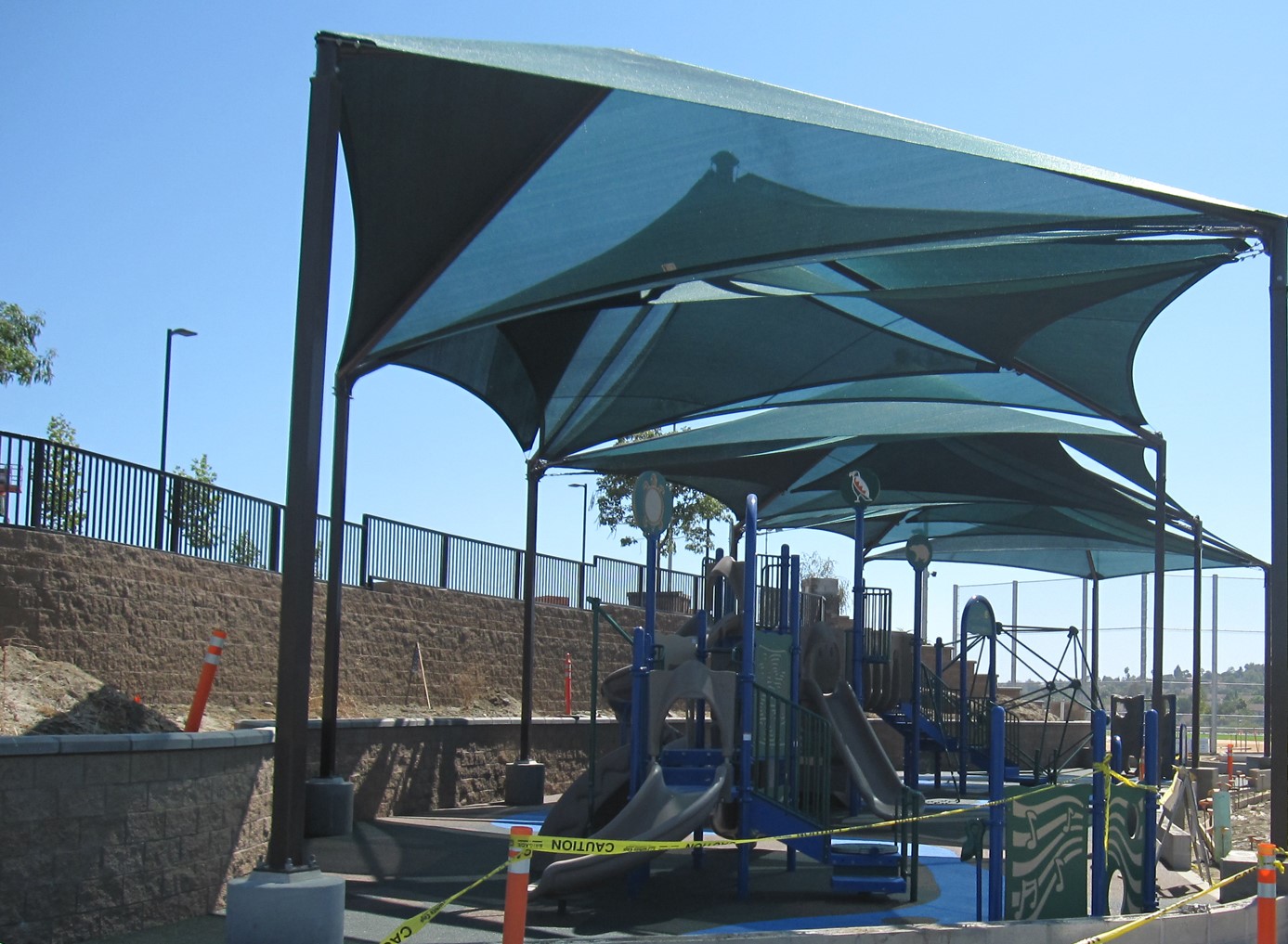 green shades covering playground equipment