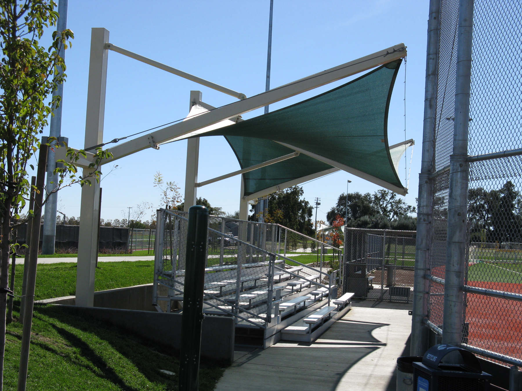 baseball field bleachers covered by usa shade