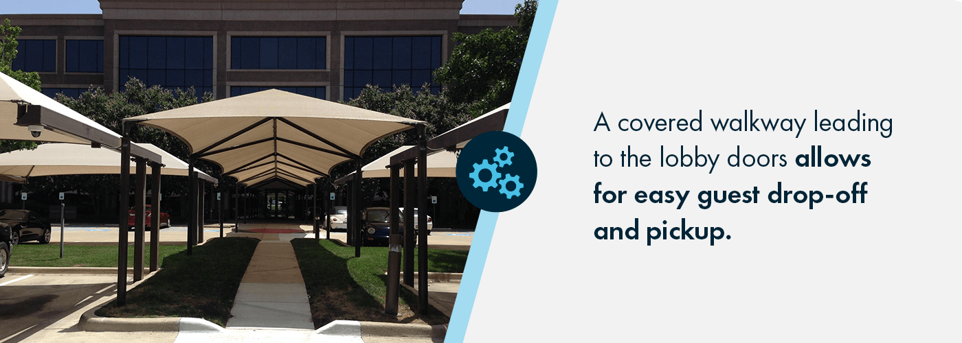 A covered walkway leading to the lobby doors allows for easy guest drop-off and pickup.